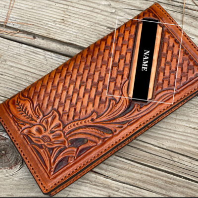 “Hand-tooled leather wallet featuring a rich basketweave pattern and elegant floral design with personalization. Expertly crafted from premium full-grain leather with beautiful hand-stitching. Timeless style and everyday durability.”